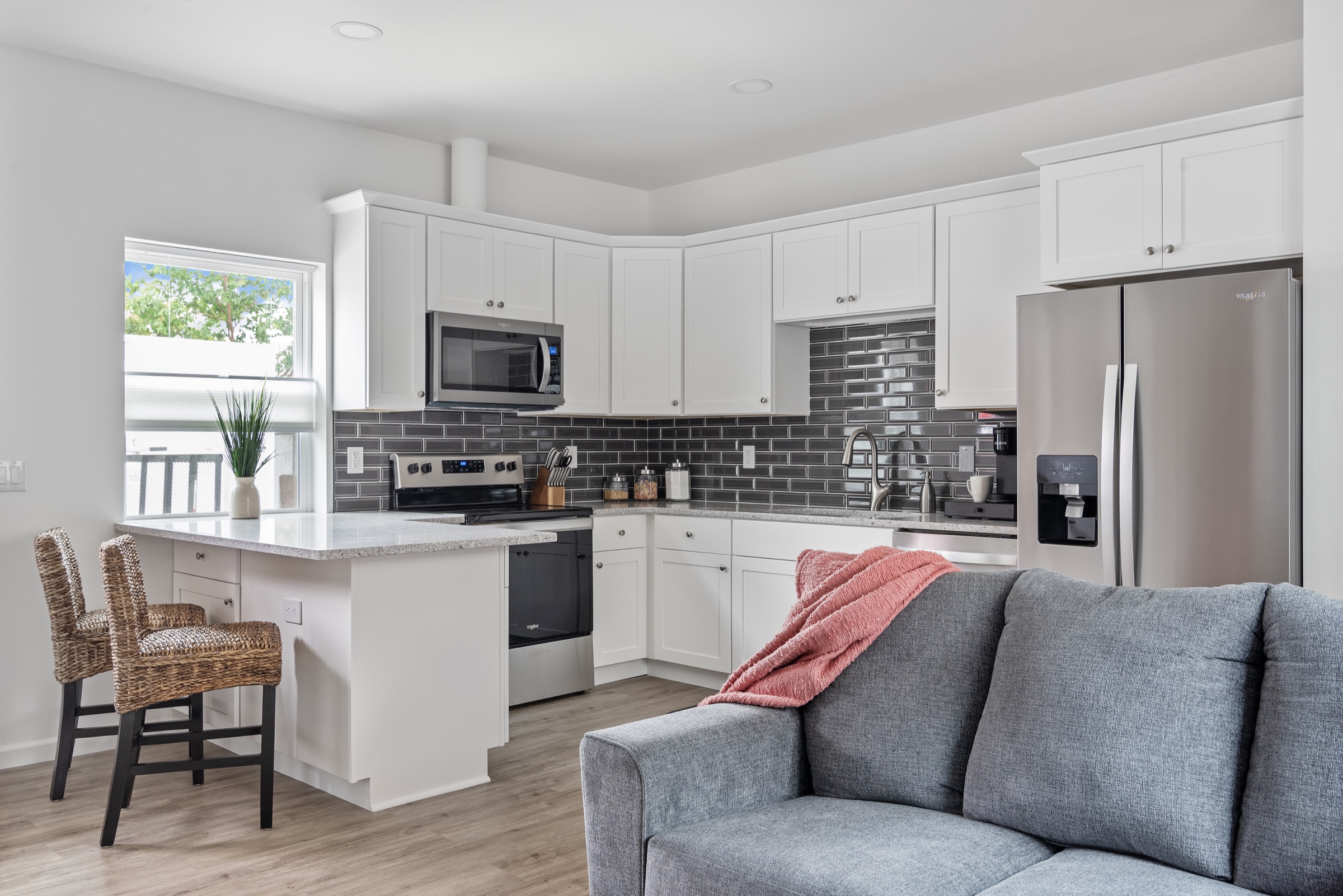 Compact ADU kitchen with full-size appliances and efficient storage