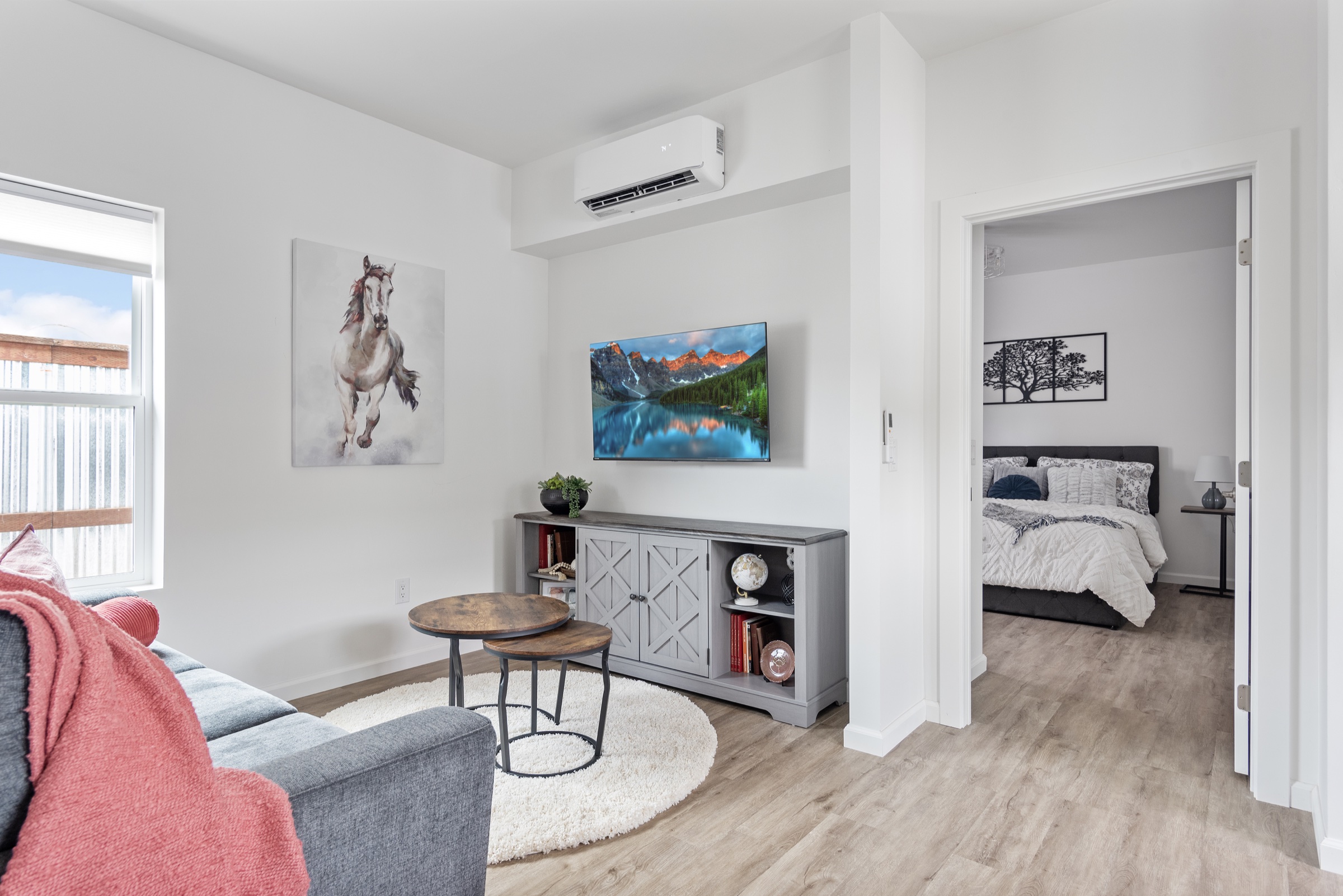 Bright ADU living room with an open kitchen connection