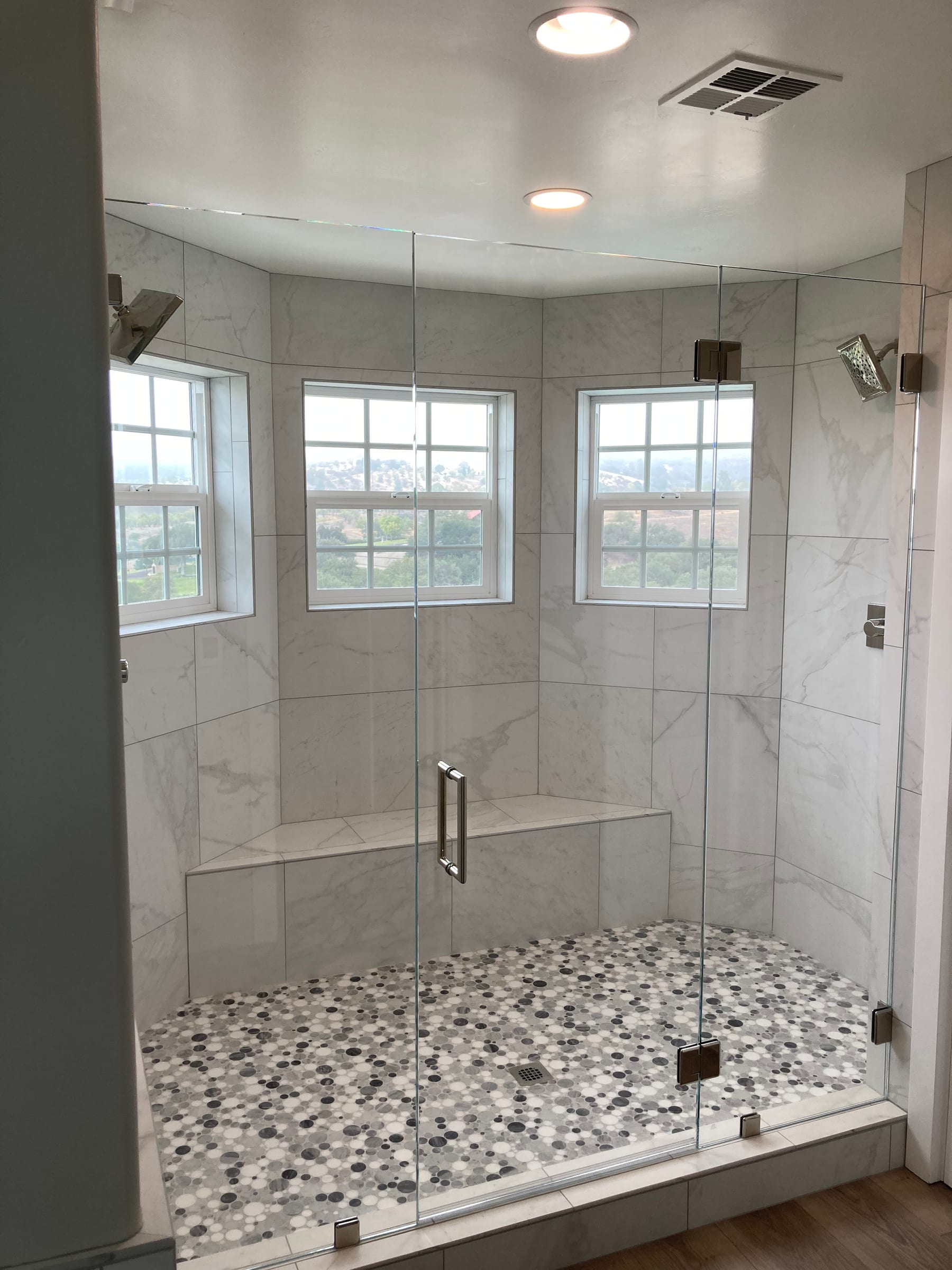 Primary bathroom shower with detailed tilework