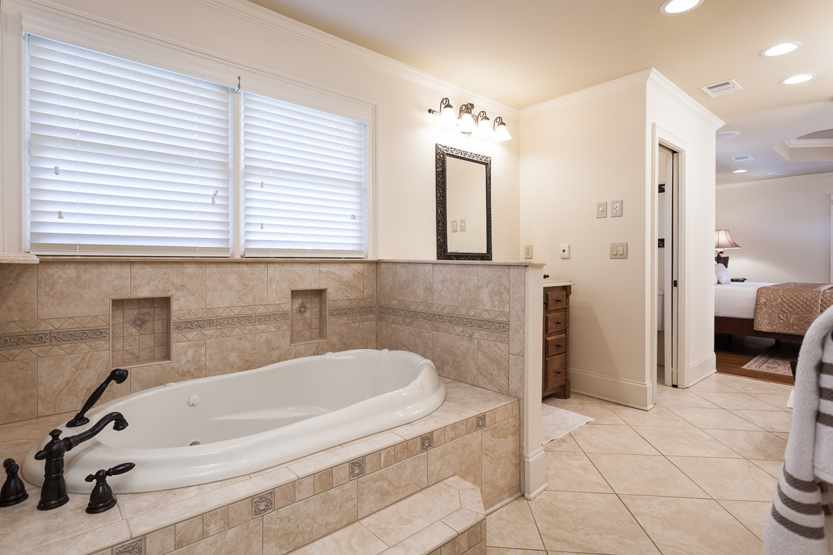 Freestanding bathtub in a completed bathroom remodel