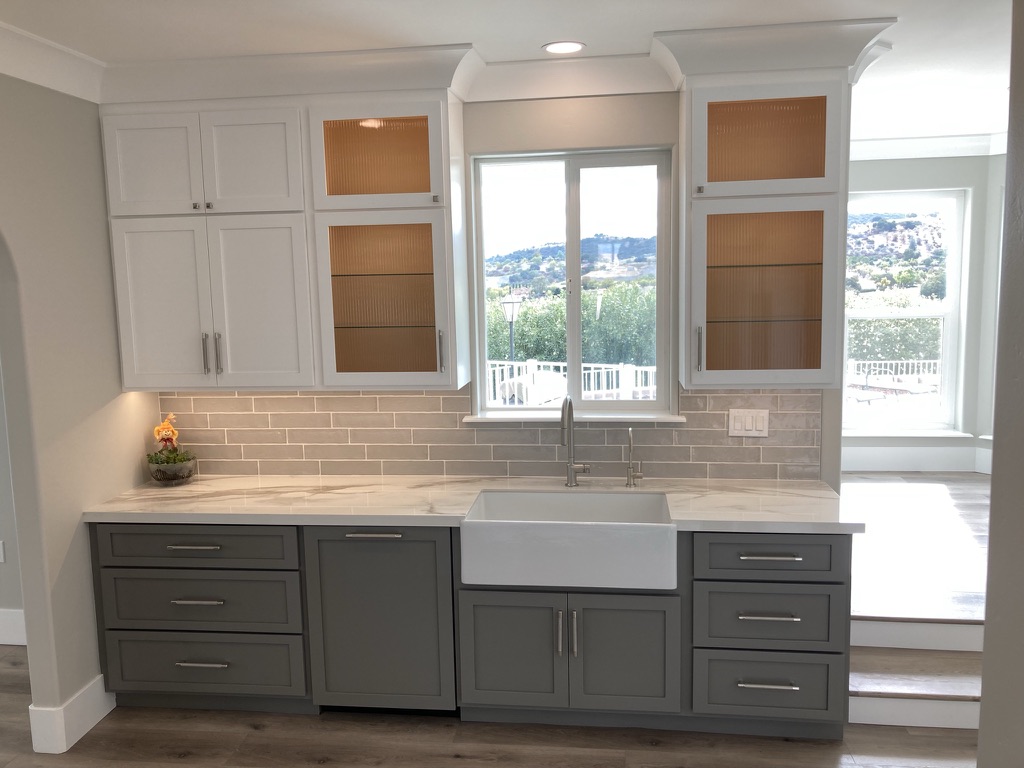 Open-concept kitchen remodel with custom cabinetry and a large window in Paso Robles