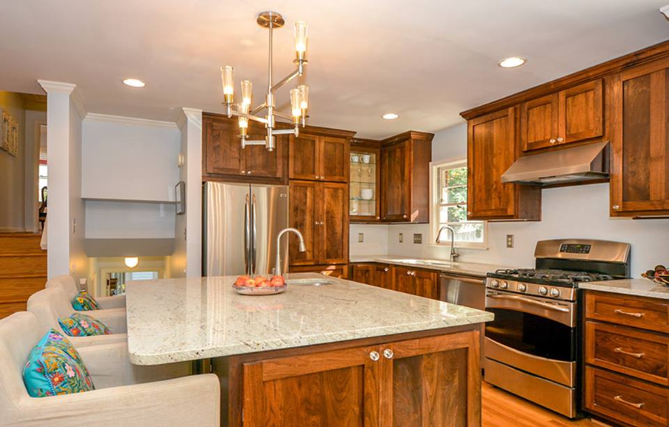 Kitchen with a custom walnut island and integrated storage